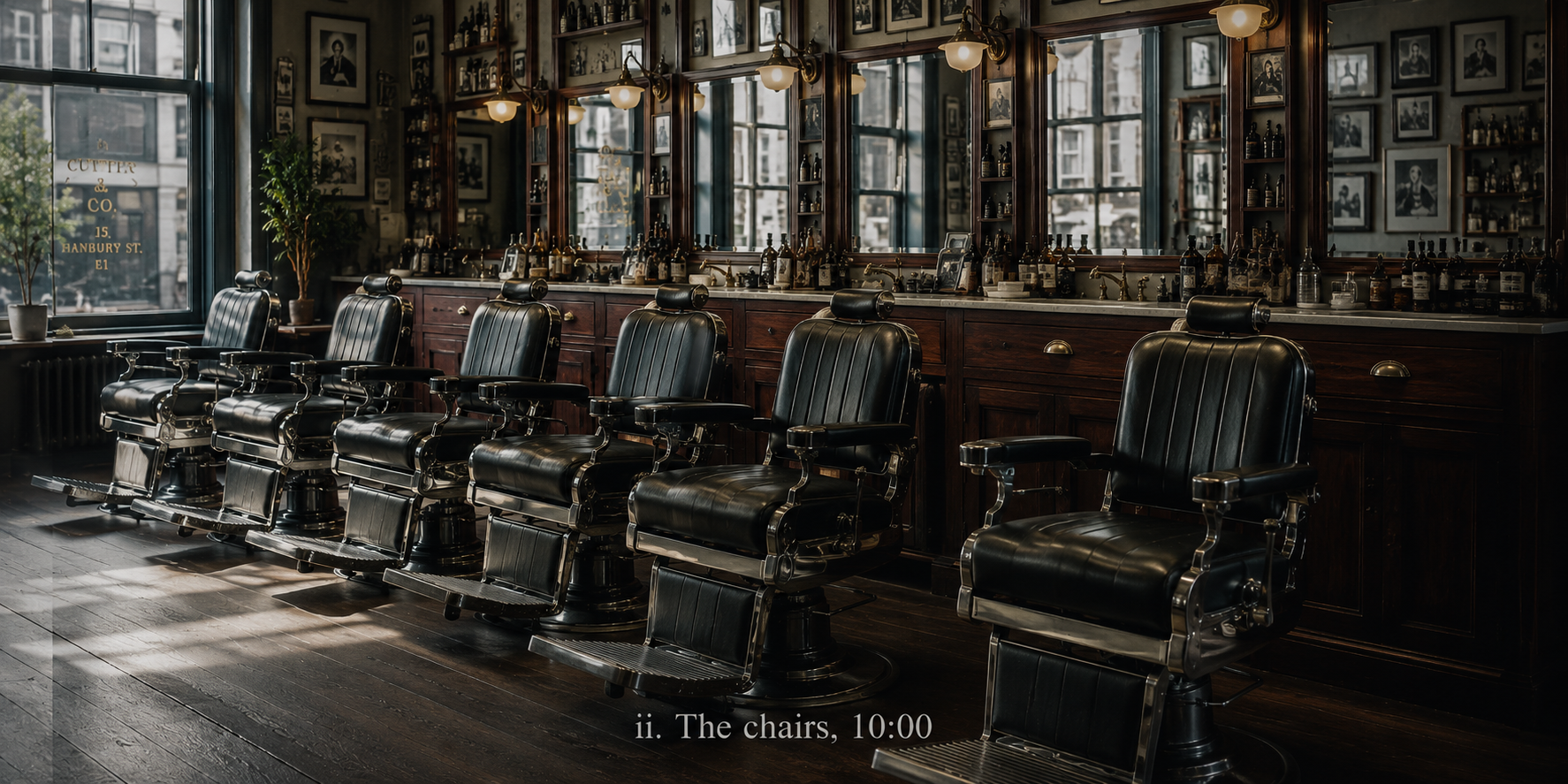 The six barber chairs lined up, photographed mid-morning